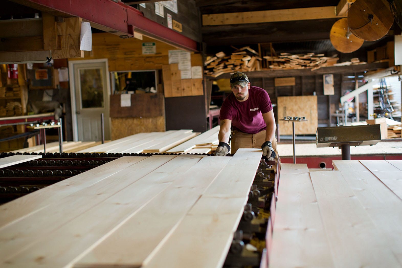 Hammond Lumber Company Sawmill Belgrade Worker inspecting boards